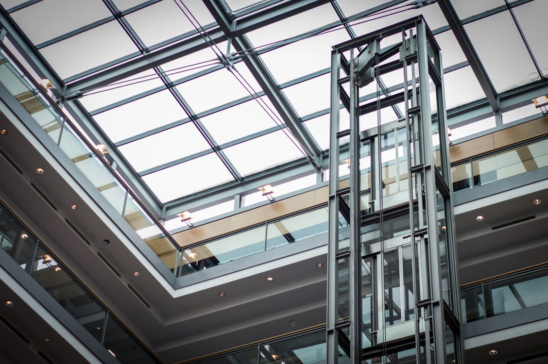 Modern glass elevator in a commercial building lobby in Dubai
